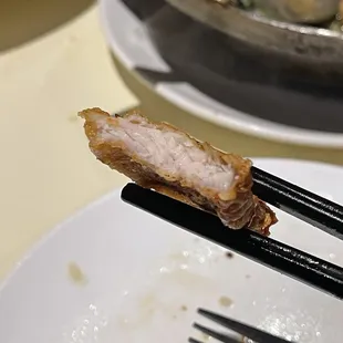 a piece of meat on a fork