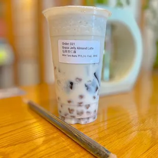 Grass Jelly Almond Latte w/ mini taro balls 7/2022