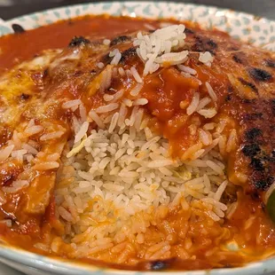 Baked pork chop with tomato sauce and cheese on rice