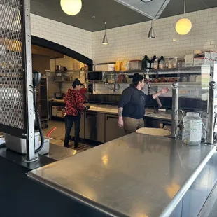 two people in a kitchen
