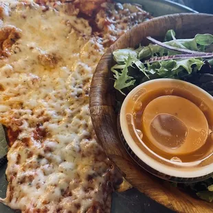 Equator pizza slice and salad