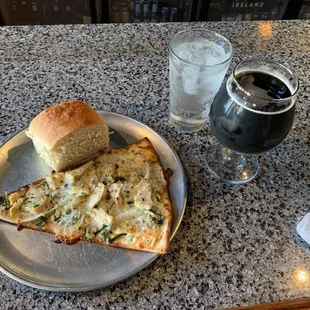 A slice of The Milano with a draw of schwarzbier