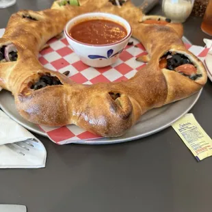 The Stromboli is wonderful the owner was very friendly and the service was excellent.
