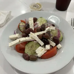 Horiatiki Village salad -fresh, light, tomatoes,cucumbers,onions, Kalamata olives, feta, seasoned