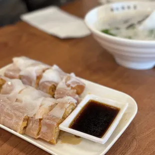 Chinese donut rice roll with porridge in the back