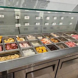 a variety of food items in a display case