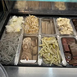a variety of foods in trays