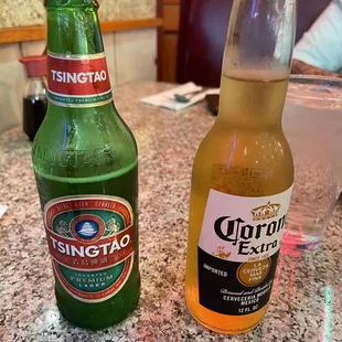 two bottles of beer on a table