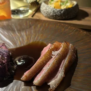 a plate of food with meat and vegetables