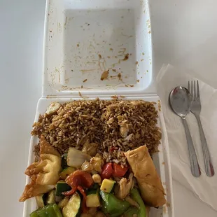 Kung pao chicken combo served in to-go box while dining inside