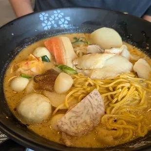 Build Your Own hot pot bowl: Mild house broth with beef, seafood, and veggies