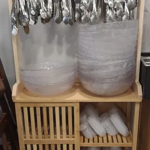 Tongs and plastic bowls for raw ingredients