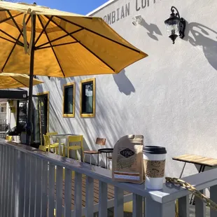 a cafe with yellow umbrellas