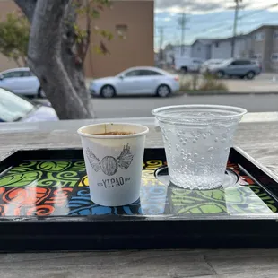 Machiatto served with seltzer water