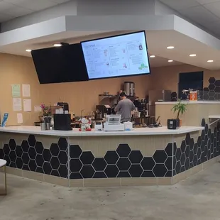 View of the menu screen, service counter, and some seating