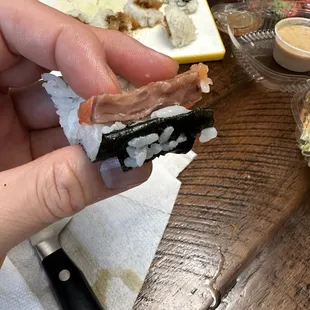 Not sure what happened to this salmon. Was it defrosted and over cooked or did they not butcher the meat correctly?