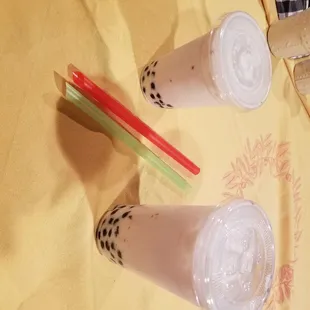 Small jasmine milk tea and large jasmine milk tea both with lite sweetness and boba!