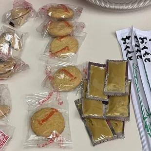 Family dinner for 4 (part 2) Fortune cookies, almond cookies (there were 6), and ginger sauce with some chopsticks.