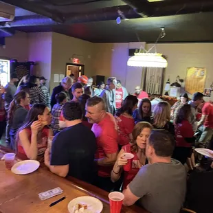 a large group of people at a bar