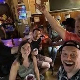 a group of people at a bar