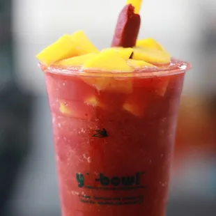 a smoothie in a plastic cup