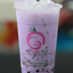a close up of a cup of bubble tea