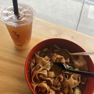 Spicy hunan noodle soup and lychee peach bubble tea
