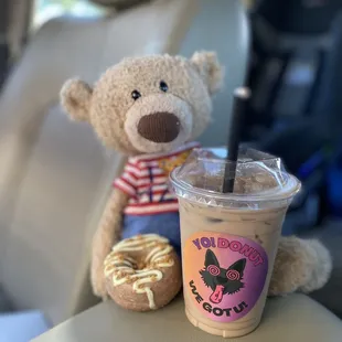 a cup of iced coffee and a teddy bear