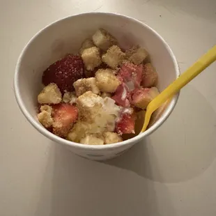 Frozen yogurt with toppings.