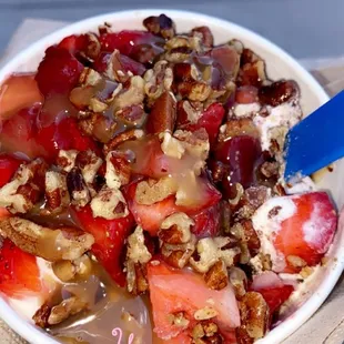 Strawberry shortcake frozen yogurt with strawberry pecan and caramel toppings
