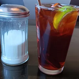 a drink and a salt shaker