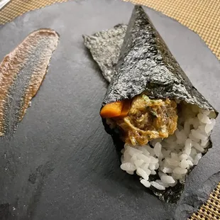 a piece of sushi on a plate
