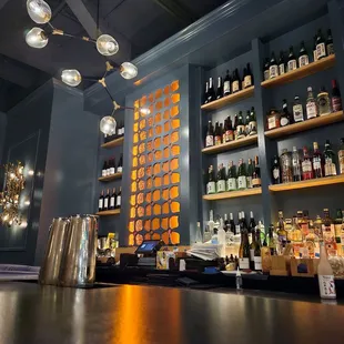a bar with bottles of alcohol