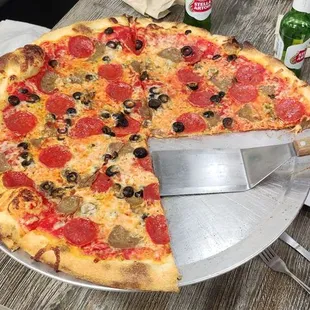 Wise Guy with pepperoni, sausage, and black olives.