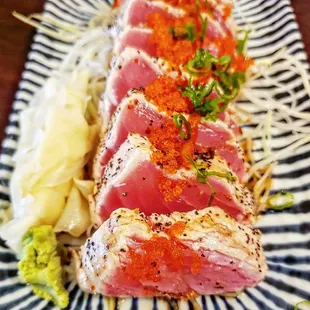 a close up of a plate of sushi