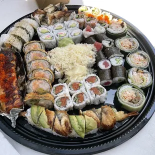 a platter of sushi and rolls