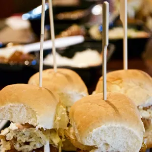 a plate of sandwiches with toothpicks