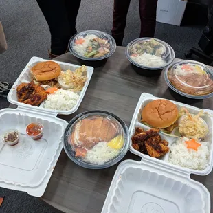 The office lunch line up. Chicken katsu bentos, Curry bowl in the top right. Katsu bowl in the middle. Veggie bowl in top left.