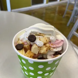 a cup of yogurt with toppings