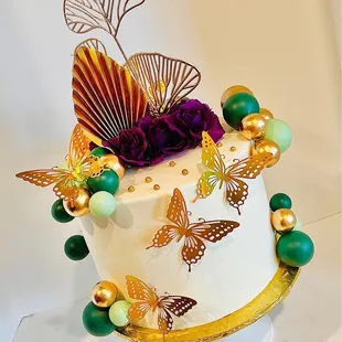 a cake decorated with butterflies