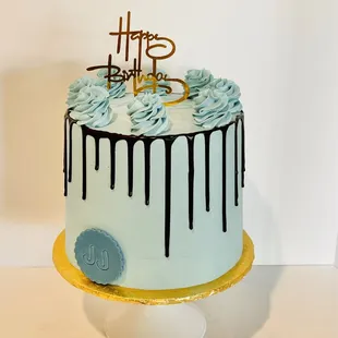 a birthday cake with drips