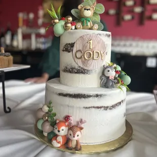Chocolate cake with strawberries and whipped cream filling with semi-naked frosting
