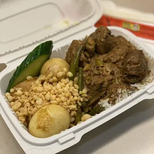 a take out container of food
