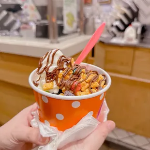 Frozen yogurt with Oreo cookie, captain crunch (free), and Nutella.