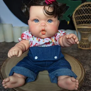 Adorable Berenguer Doll, repaired with a set of new reborn eyes, half-cap wig, and handmade clothes.