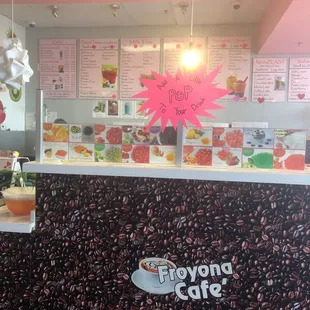 the front counter of a frozen yogurt cafe