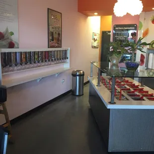 Wall of sprinkles! Lots of toppings to add to your yogurt.