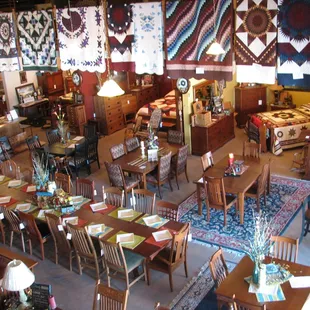 Amish made furniture and hand quilted quilts on display at Yoder Furniture Co.