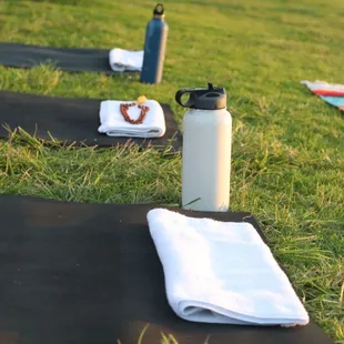 We provide yoga mats, towels and water (bring your own cup)