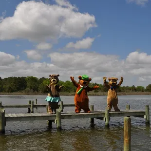 Yogi Bear, Boo Boo, and Cindy Bear on the pier